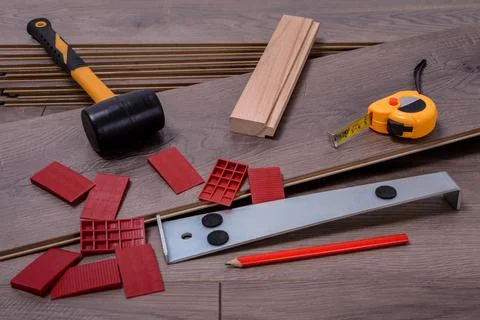 Carpenter tools on laminated flooring Stock Photos