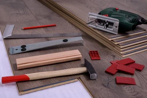 Carpenter tools on laminated flooring Stock Photos