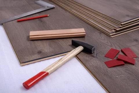 Carpenter tools on laminated flooring Stock Photos