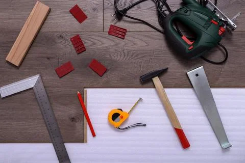 Carpenter tools on laminated flooring Stock Photos