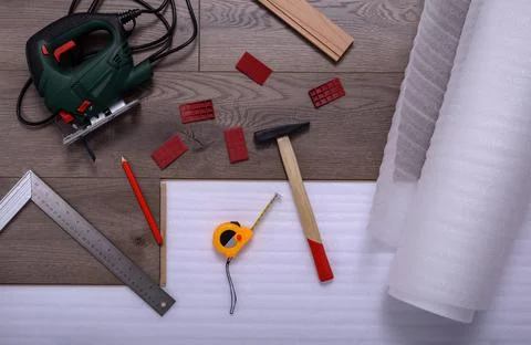 Carpenter tools on laminated flooring Stock Photos