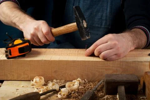 Carpenter tools on wood table background. Top view. Copy space Stock Photos
