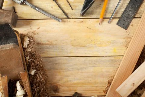 Carpenter tools on wood table background. Top view. Copy space Stock Photos