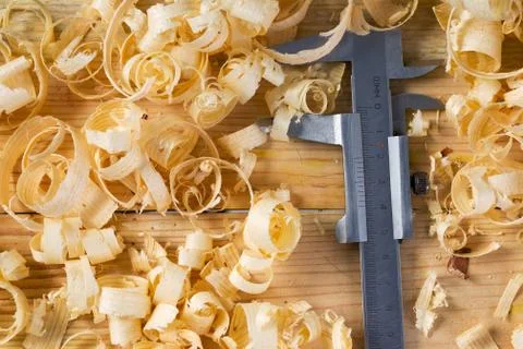 Carpenter tools on wood table background with sawdust. Copy space Stock Photos