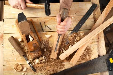 Carpenter tools on wood table background. Top view. Copy space Stock Photos
