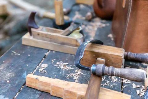 Carpenter tools for working with wood scraper and wooden hammer Stock Photos