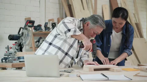 Carpenter use electric drill to drill wood Stock-Footage 172039413