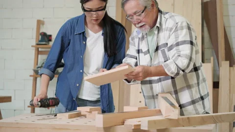 Carpenter use electric drill to drill wood Stock-Footage 172039474