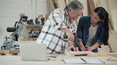 Carpenter use electric drill to drill wood Stock-Footage 172039494