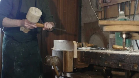 Carpenter uses a carpenter's chisel Stock Footage 97462596