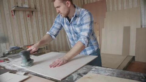Carpenter uses a grinding machine to align Stock-Footage 153494511