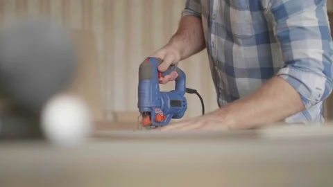 Carpenter uses a grinding machine to align Stock-Footage 153494749