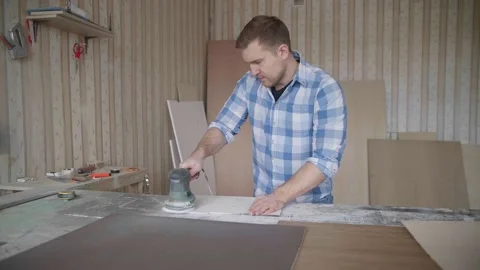 Carpenter uses a grinding machine to align Stock-Footage 153494790