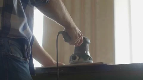 Carpenter uses a grinding machine to align Stock-Footage 153495222