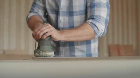 Carpenter uses a grinding machine to align Stock-Footage 153495260