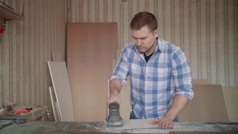 Carpenter uses a grinding machine to align Stock-Footage 153495565