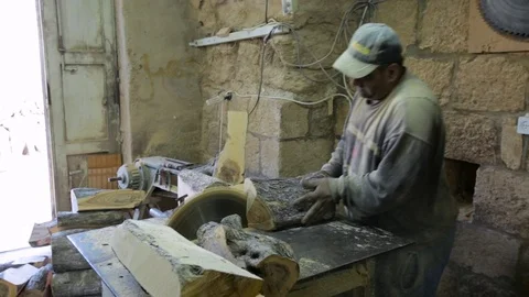 Carpenter Using Circular Saw cutting wood in workshop Stock Footage 70874342