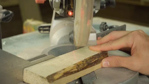 Carpenter using circular saw for cutting wooden board. 库存影片 129175247