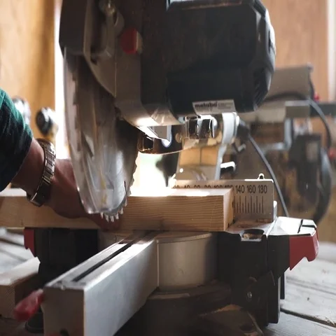 Carpenter Using Circular Saw for wood in close up Stock Footage 69536979