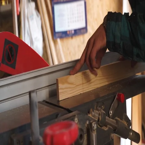 Carpenter Using Circular Saw for wood in close up Stock Footage 69537566