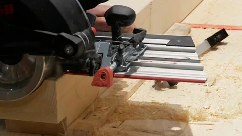 Carpenter using Electric Wood Cutter making wooden furniture in DIY workshop. Stock Footage 167659236