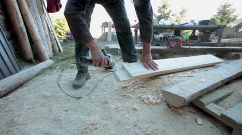 Carpenter using grinder, polishing timber - steadicam Stock Footage 57274418