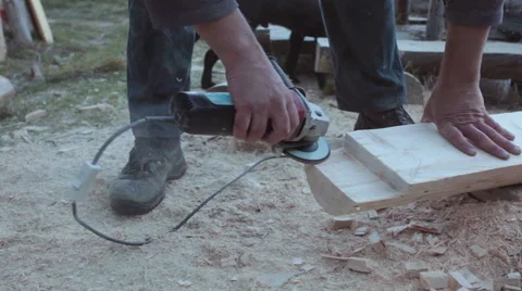 Carpenter using grinder, polishing timber - steadicam Stock Footage 57274506