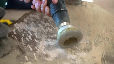 Carpenter using grinding machine with circle metal nozzle for sanding wooden Stock Footage 234984073