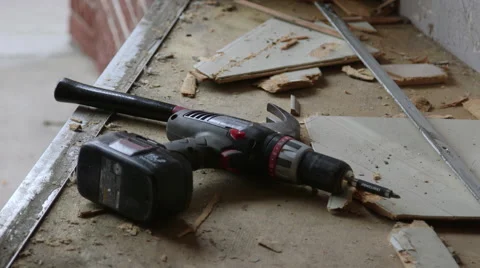 Carpenter Using Hammer and Power Drill to Demolish Building Interior Stock Footage 61507751