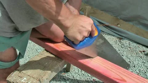 Carpenter using handsaw Stock Footage 18038899