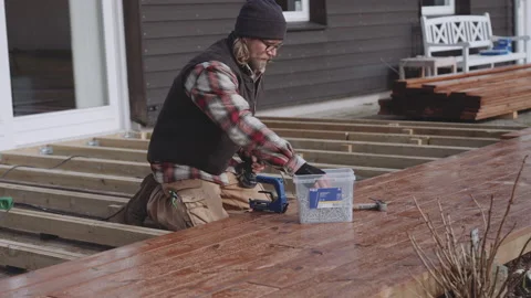 Carpenter Using Hidden Deck Fastener Video stock 151499319