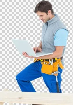 Carpenter using laptop over white background Stock Photos