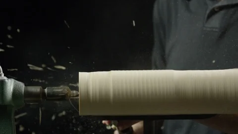 Carpenter using lathe machine to shape the wood in workshop Stock Footage 104222535