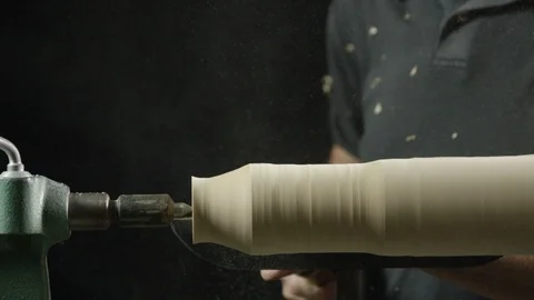 Carpenter using lathe machine to shape the wood in workshop Stock Footage 104222747