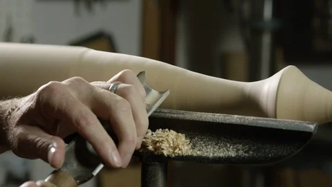 Carpenter using lathe machine to shape the wood in workshop Stock Footage 104223548