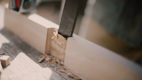 Carpenter using mallet and chisel slow motion on wooden cross Stock Footage 271199475