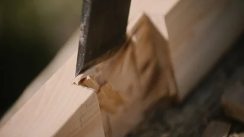 Carpenter using mallet and chisel slow motion close up, on wooden cross Stock Footage 271199589