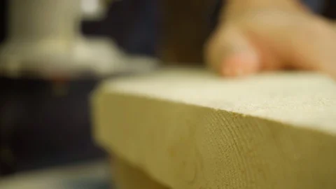 Carpenter using  manual milling machine  to smooth out the angle. Stock Footage