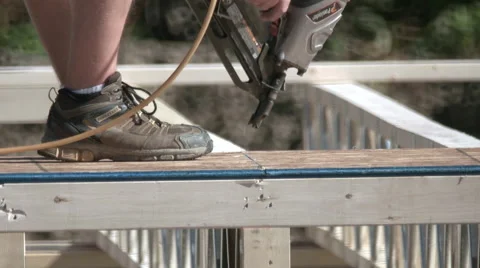 Carpenter Using Nail Gun for New Home Construction. Stock Footage 67453656