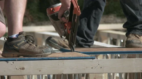 Carpenter Using Nail Gun for New Home Construction. Video stock 67453861