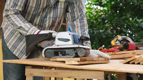 Carpenter using planer to make smooth surface. Stock Footage 134166853