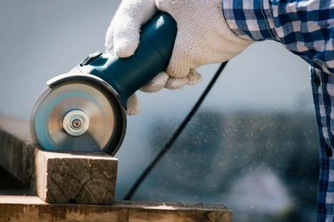 Carpenter using saw tools electric cutting wood Stock Photos