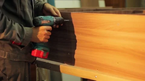 Carpenter Using Screwdriver Assembling Furniture Stock-Footage 54383742