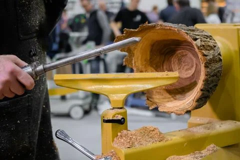 Carpenter using skew chisel for shaping piece of wood Stock Photos