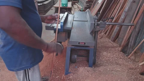 Carpenter using a table saw to cut wood in a workshop at woodworker shop Stock Footage 266864442