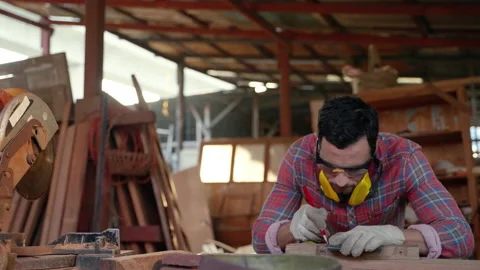 Carpenter is using Temple scene measuring to create the workpiece inside Stock Footage 147871395