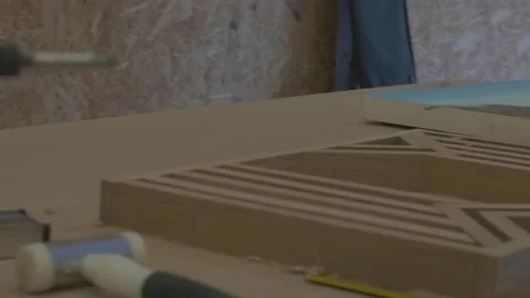 Carpenter using tools to create detailed wall piece Video stock 139449175