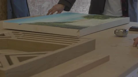 Carpenter using tools to create detailed wall piece Stock Footage 139449189