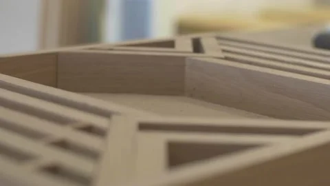 Carpenter using tools to create detailed wall piece Stock Footage 139449239