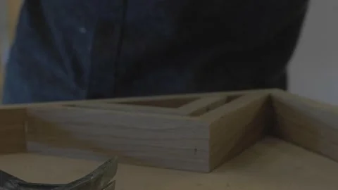 Carpenter using tools to create detailed wall piece Stock Footage 139449258